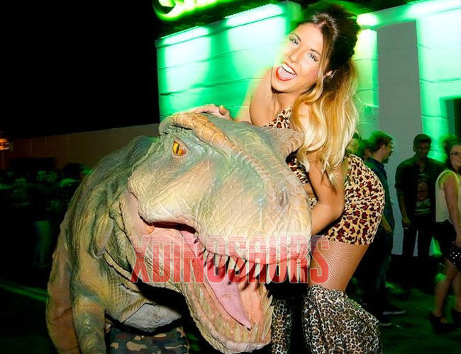 Girl Dances with Trex Prop at Night Club