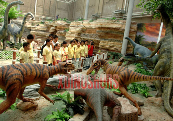 Tourists See Animatronic Dinosaurs